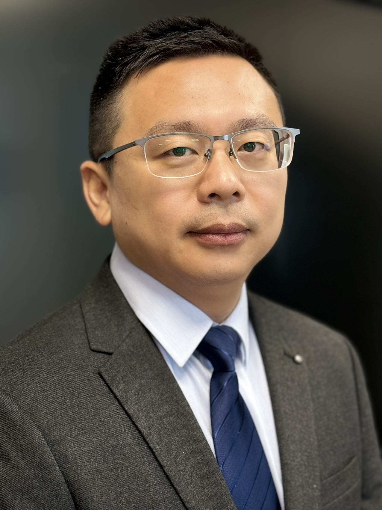 Mr. Guangjin Li